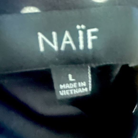 Brand: NAIF, black dress, with white dots, and flared sleeves - Picture 10 of 12